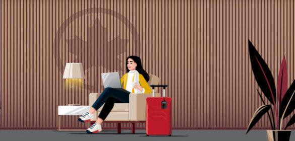 a woman sitting in a chair with a laptop