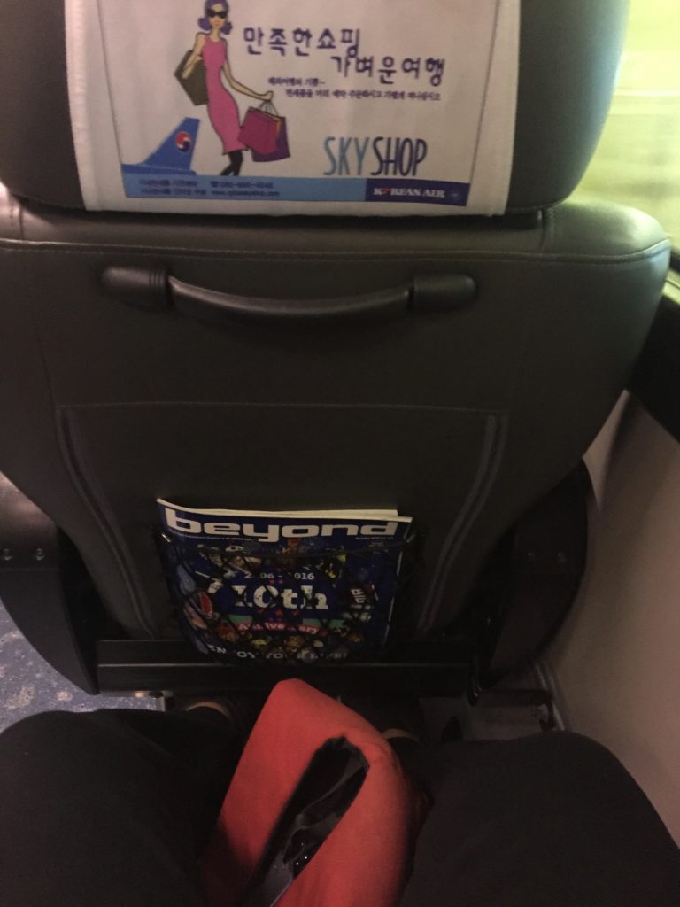 a seat with a magazine on it