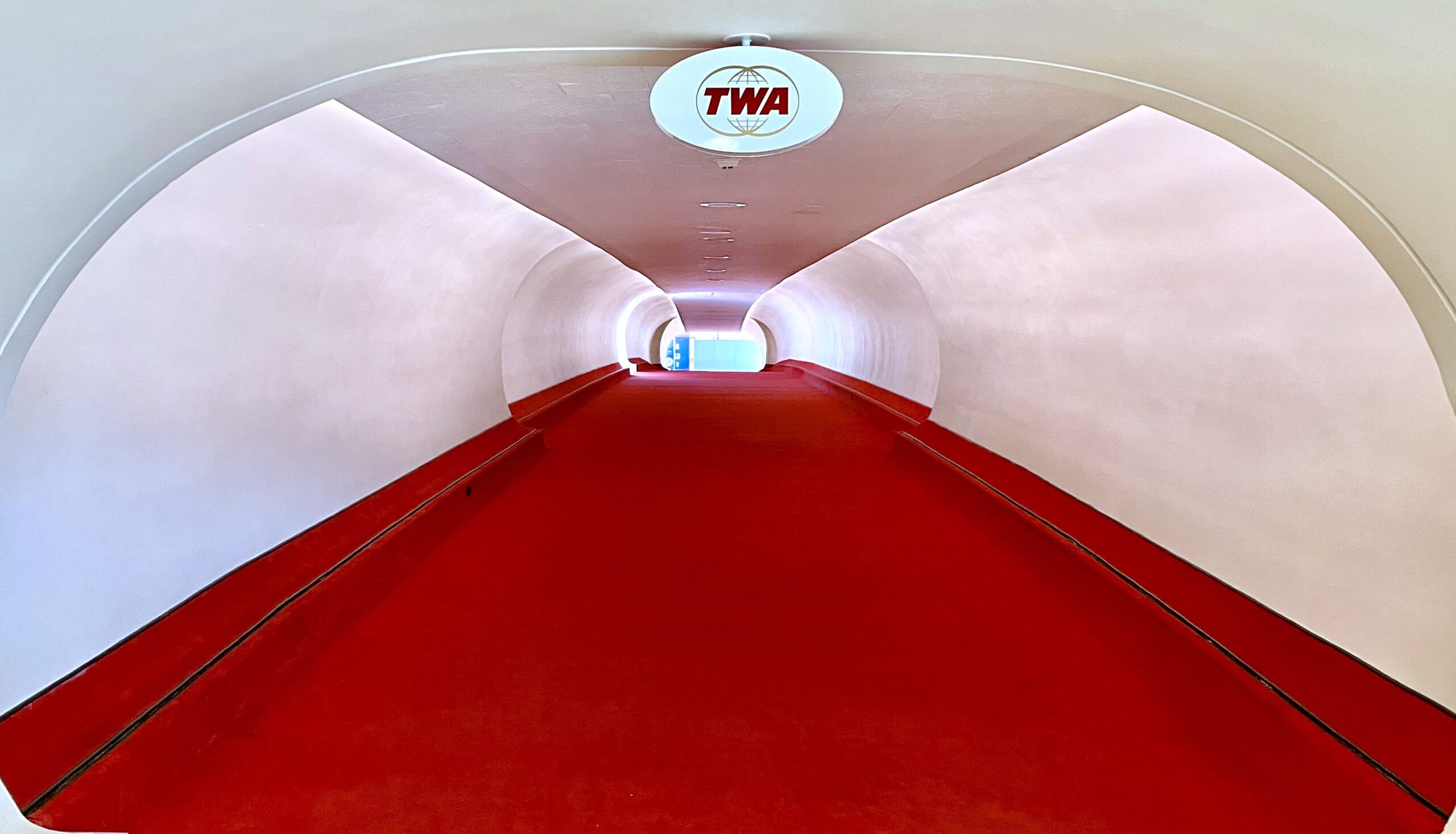 a red carpet in a tunnel