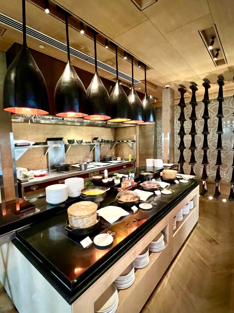a kitchen with a black countertop with food on it