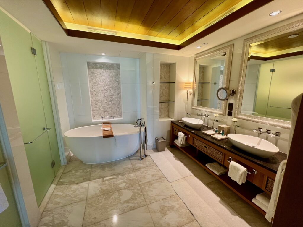 a bathroom with a tub and sinks