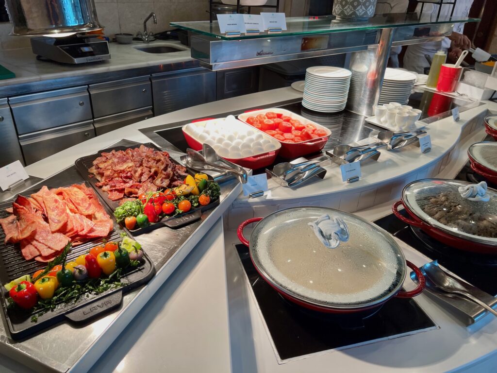 a buffet line with different types of food