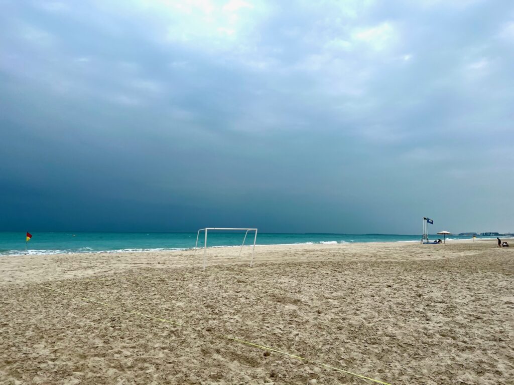 a beach with a football goal on it