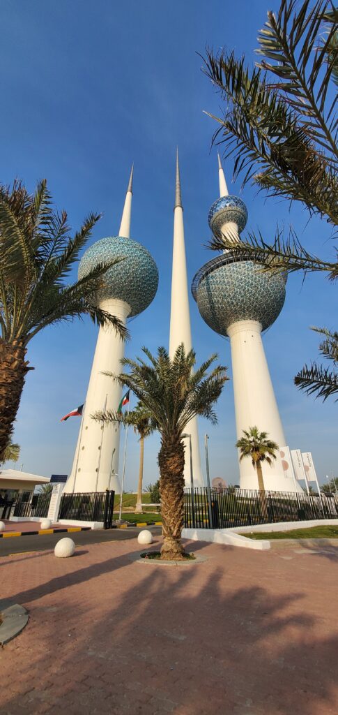 a group of tall towers with blue and white domes