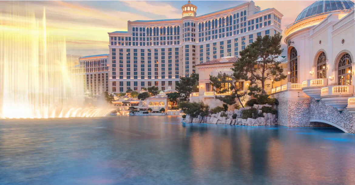a large building with a fountain in front of it
