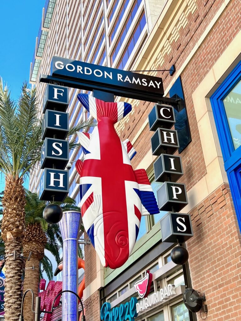 a sign with a fish and a flag on it