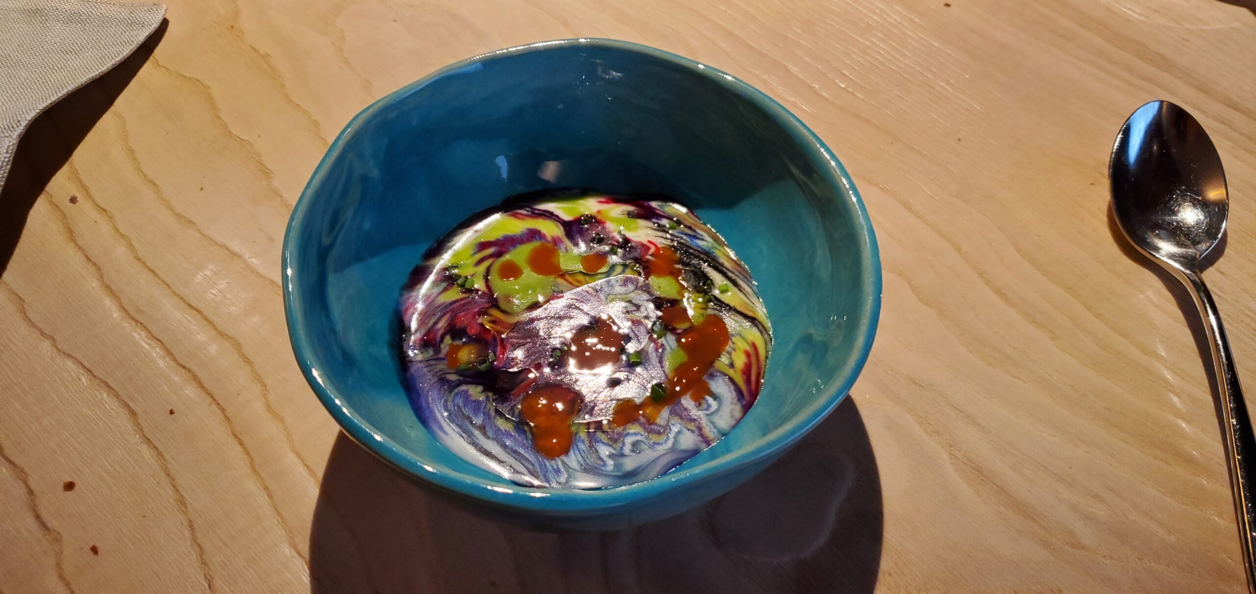 a bowl of colorful liquid