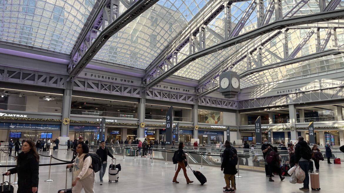 3197B442-9D98-40A9-8042-920742991527 people walking in a large building