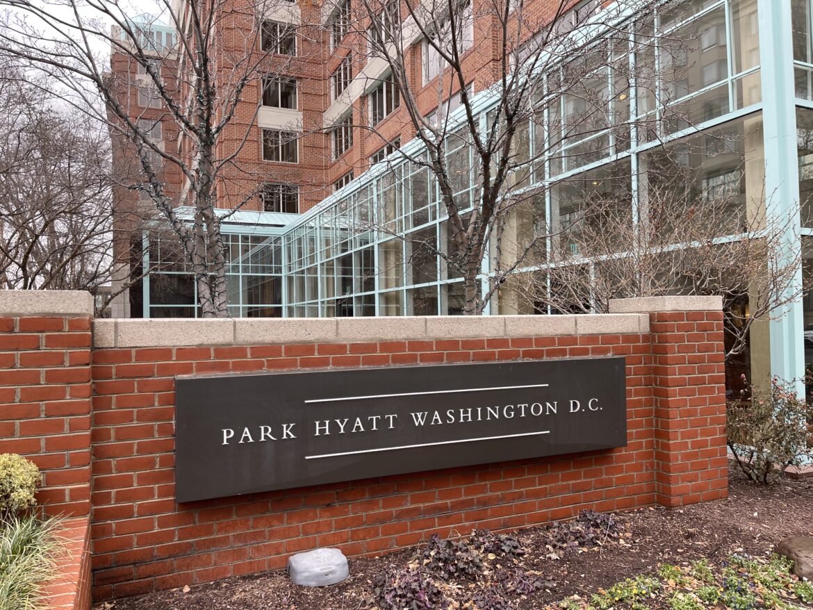 a sign on a brick wall