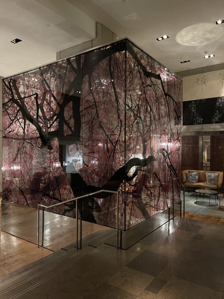 a glass cube with a tree design on it