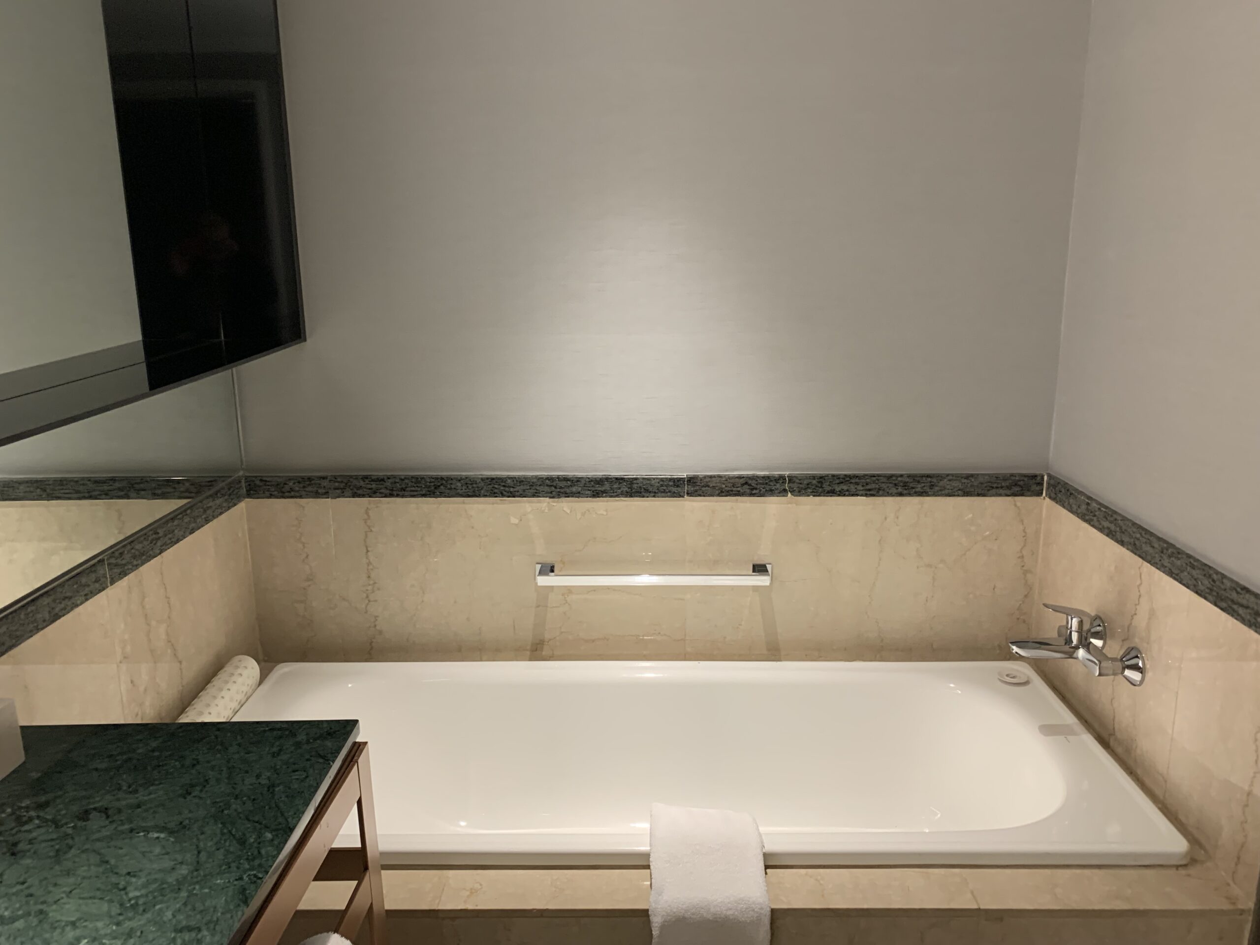 a bathroom with a bathtub and sink