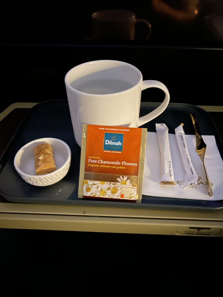 a tray with a cup and a packet of tea