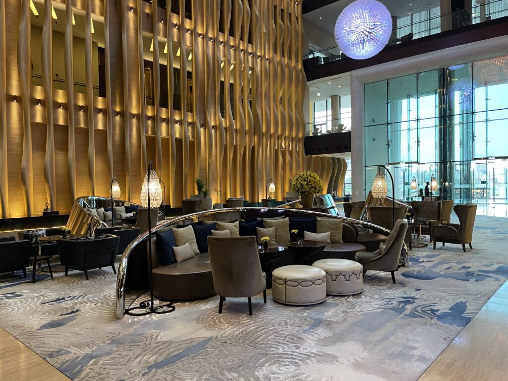 a lobby with a round table and chairs