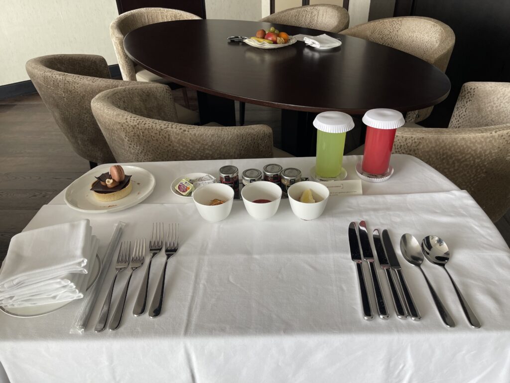 a table with a tablecloth and cutlery