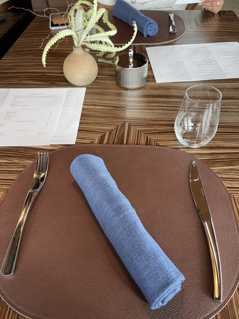 a fork and knife on a brown plate