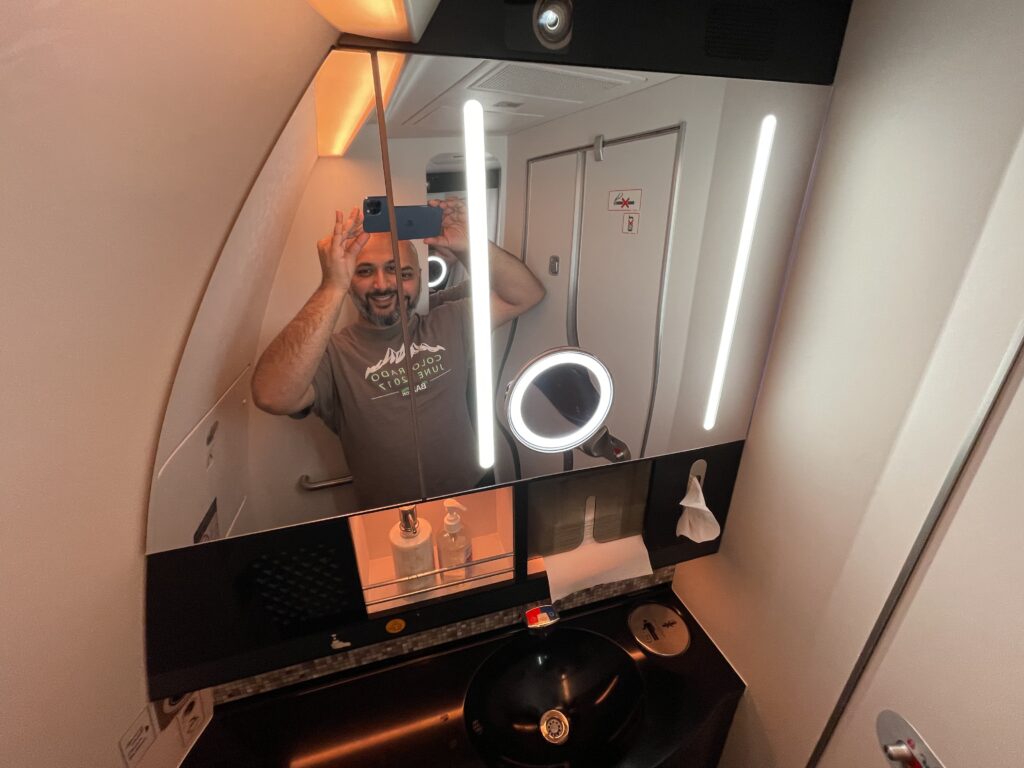 a man taking a selfie in a bathroom