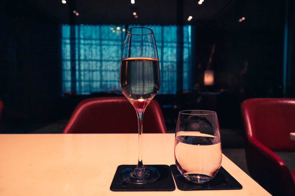 a glass of wine and a glass of water on a table