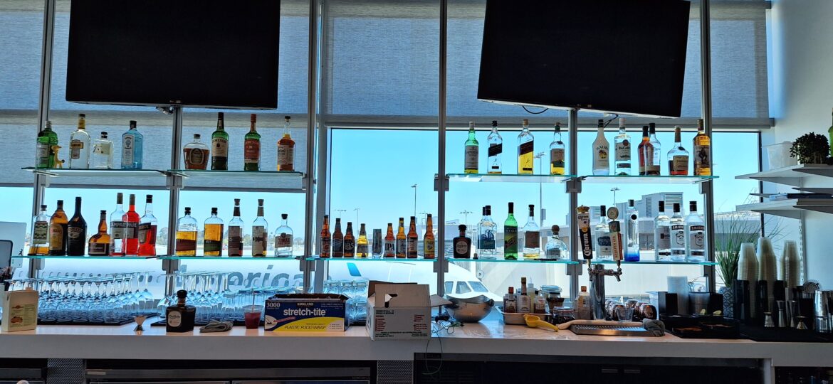 Aspire – the bar selection a shelf with bottles of alcohol on it