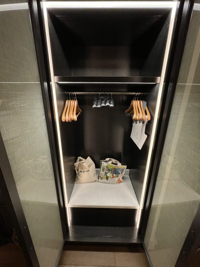 a closet with swingers and bags