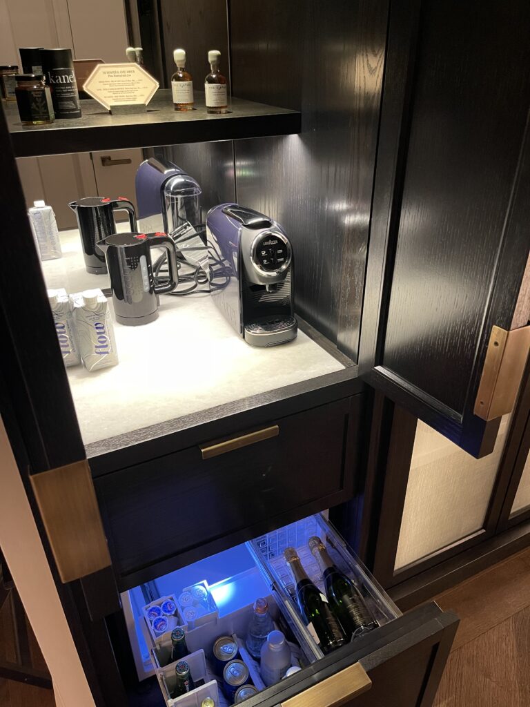 a cabinet with a drawer full of beverages