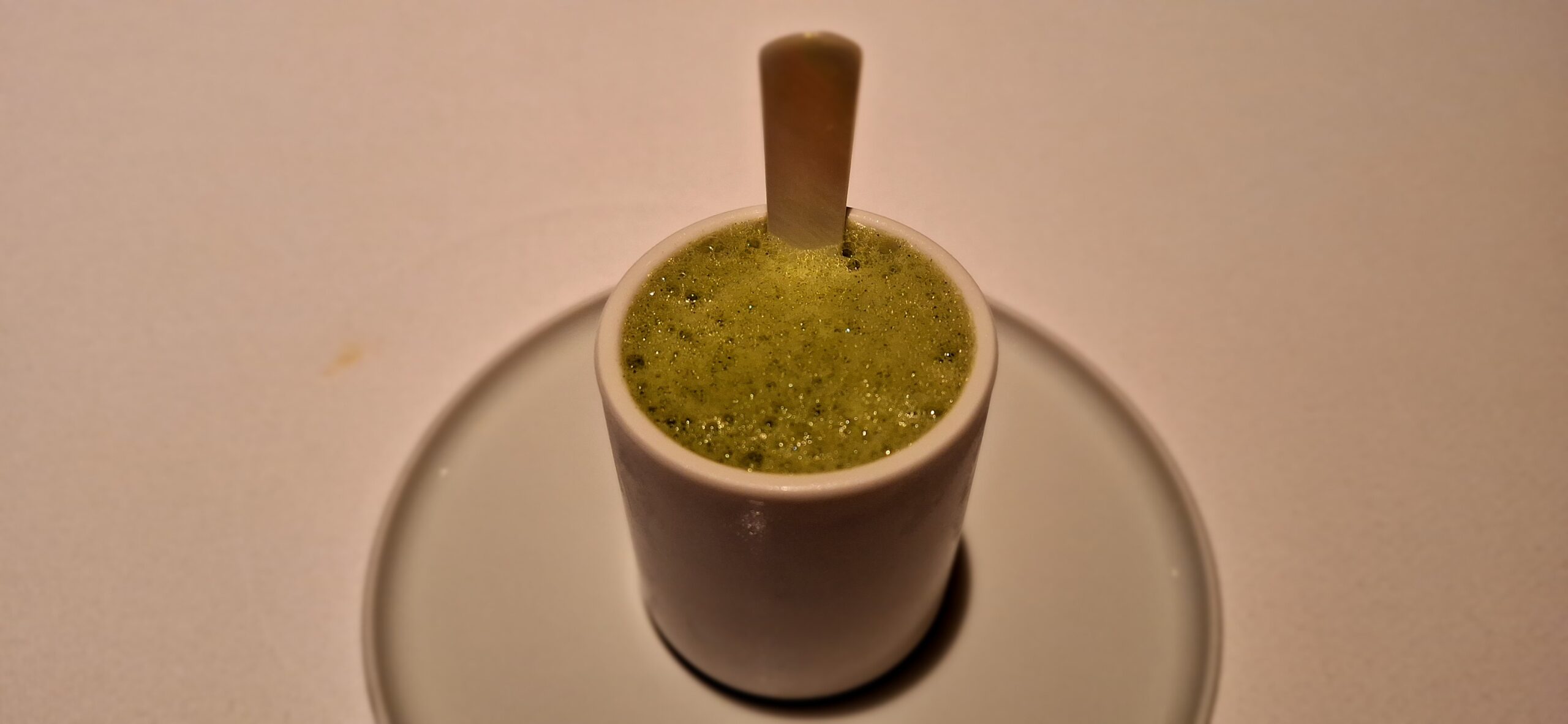 a green liquid in a cup