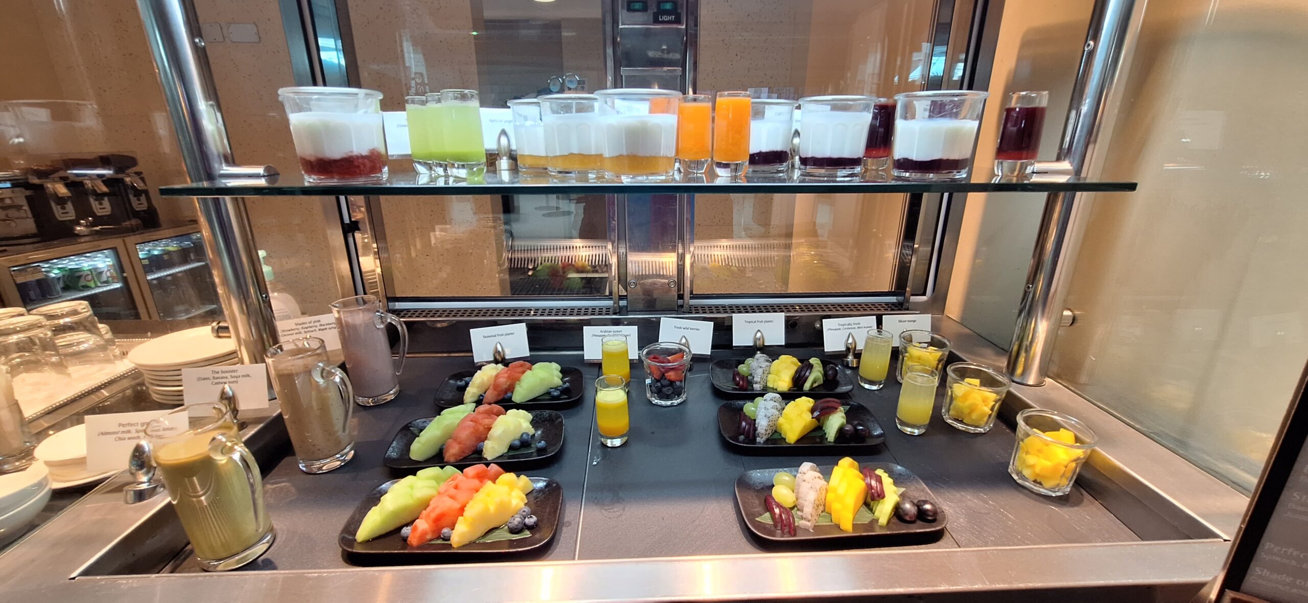 a display of different drinks on a counter