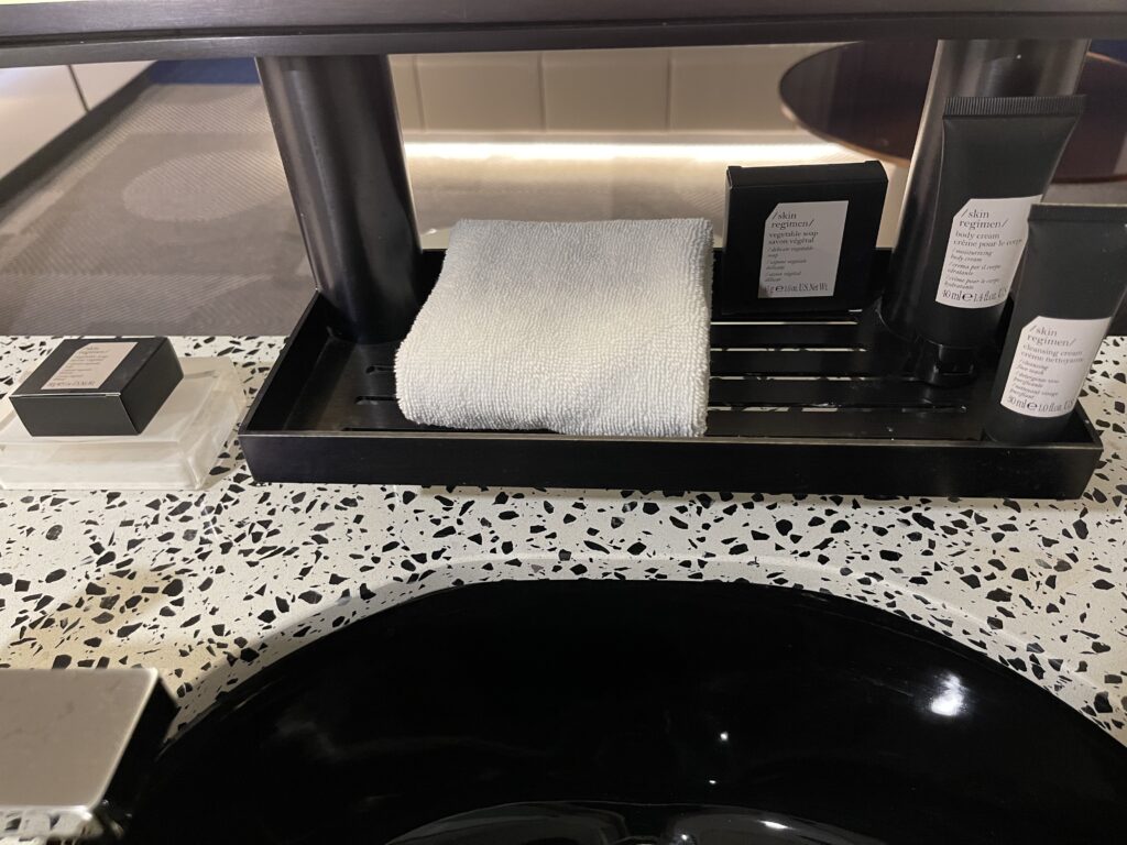 a bathroom sink with a towel and a towel on it
