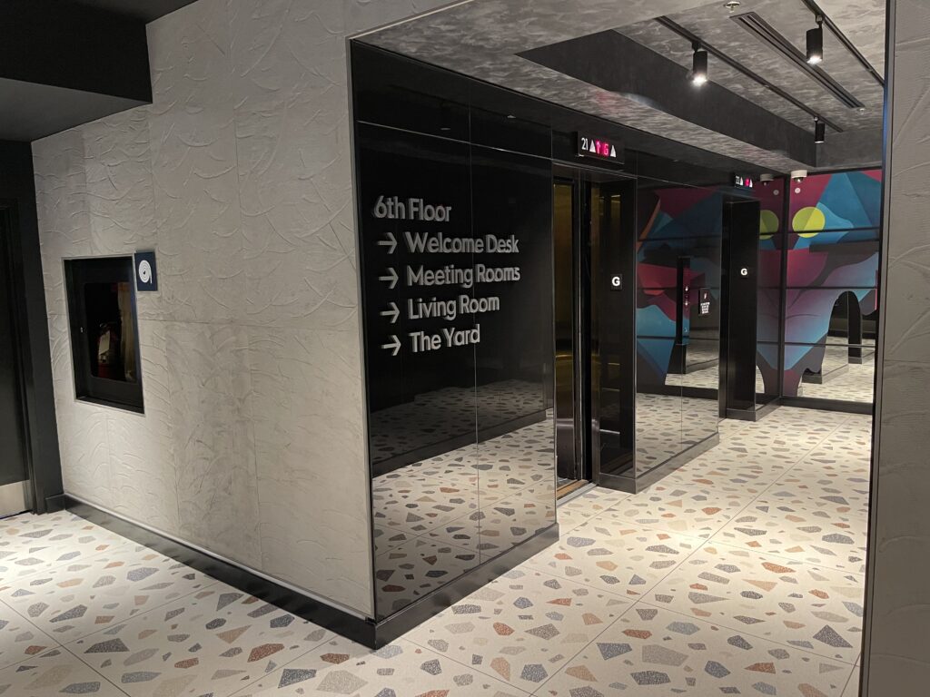 a glass doors with white text on them