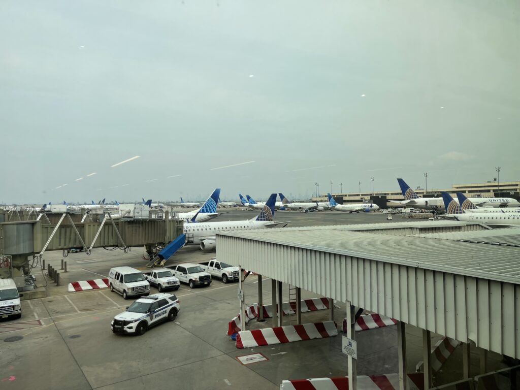 a group of airplanes parked in a terminal