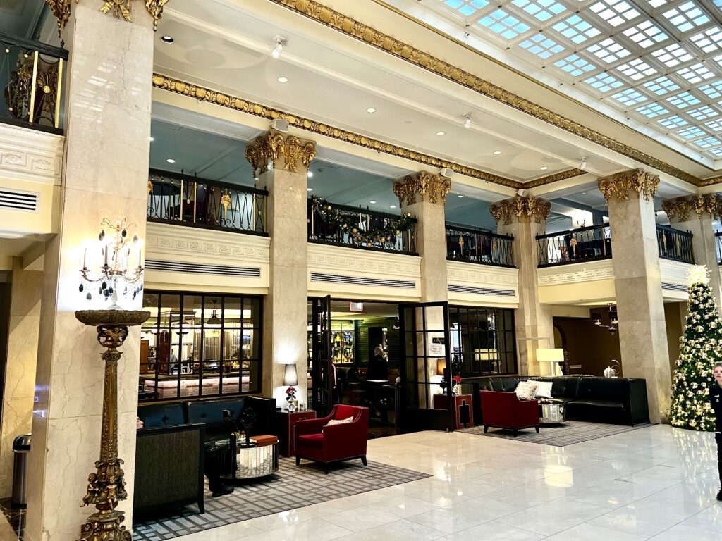 a large building with columns and a large chandelier