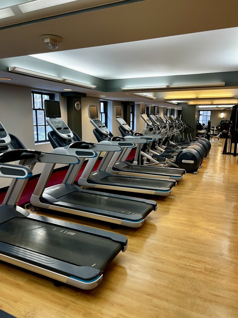 a room with treadmills and exercise equipment