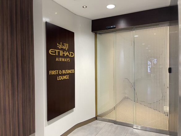a glass door with a sign on the wall