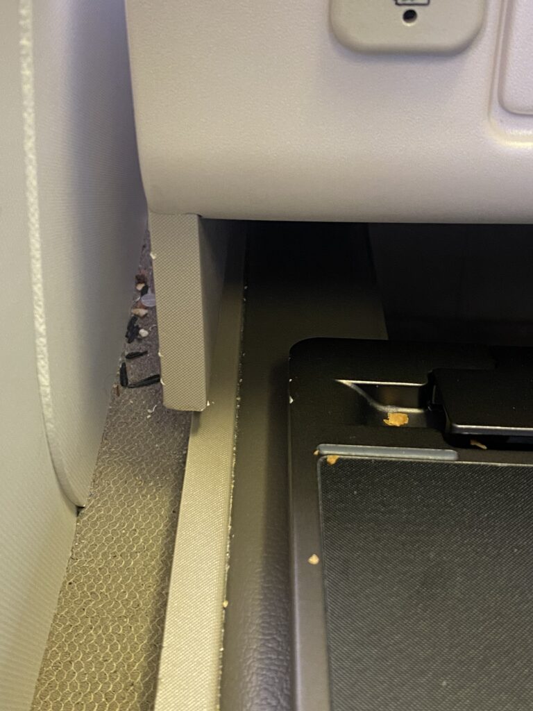 a computer mouse pad under a seat