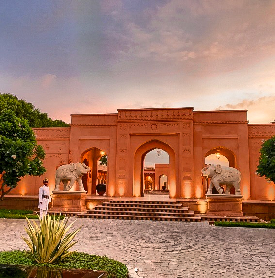 a stone building with elephants in front of it