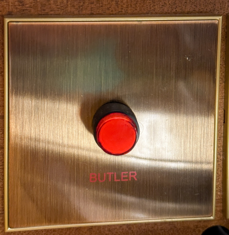 a red button on a metal surface