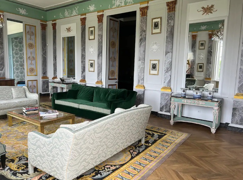 a room with a green couch and a coffee table
