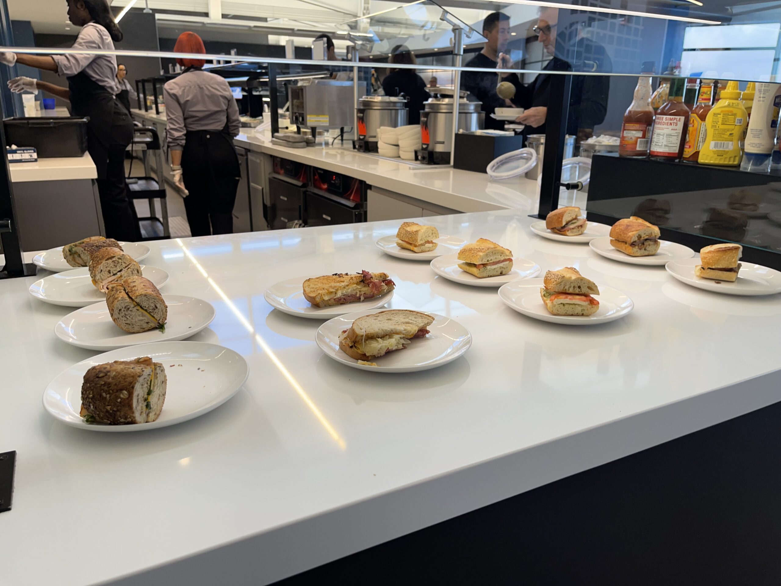 a group of sandwiches on plates on a table