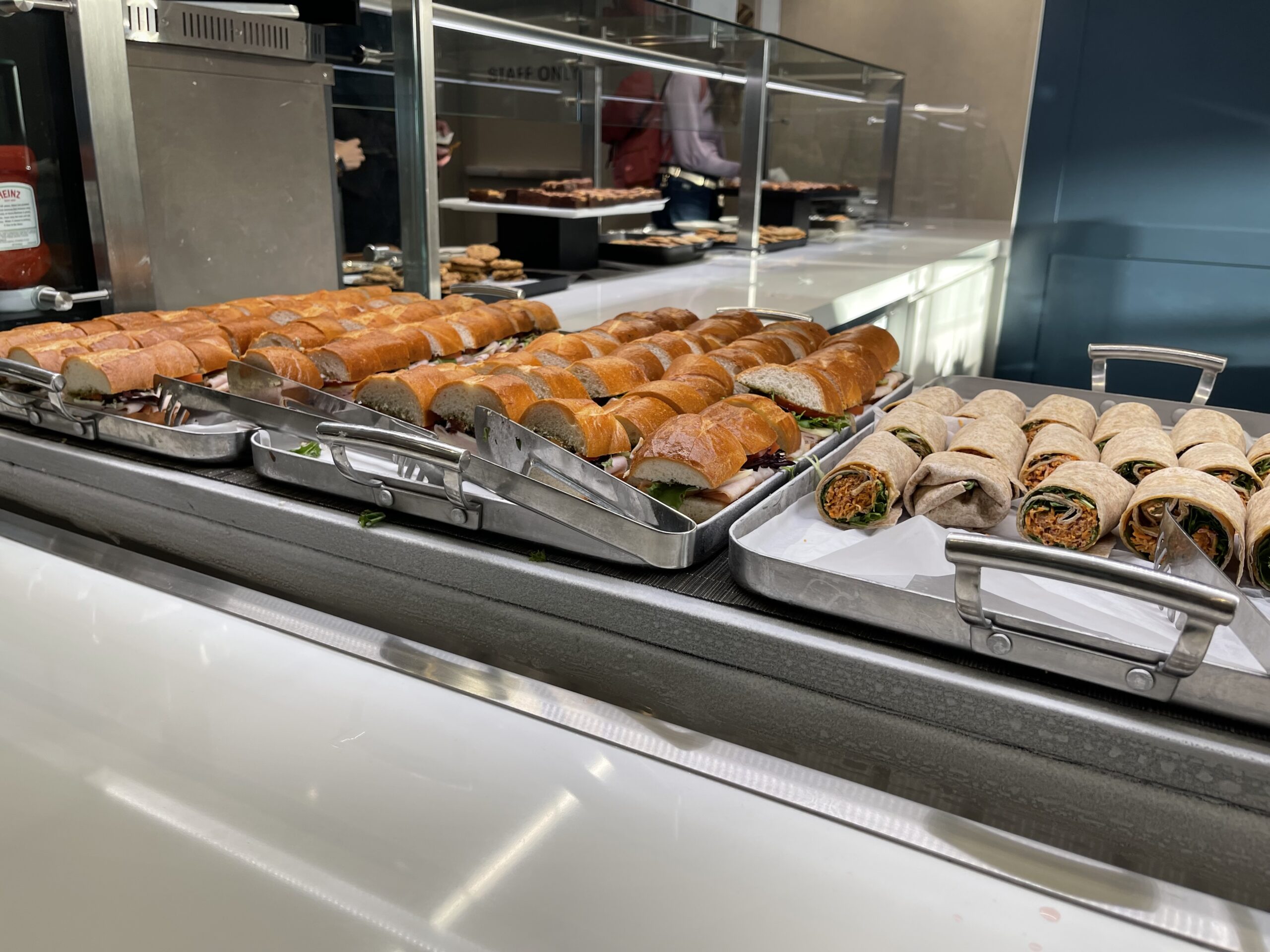 a trays of sandwiches on a counter