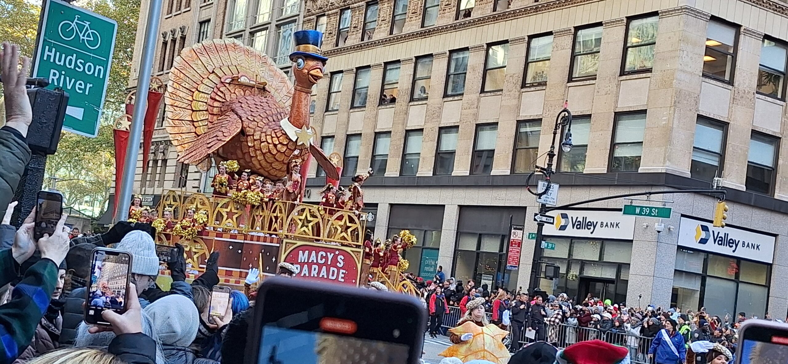 a large parade float with a large bird on top