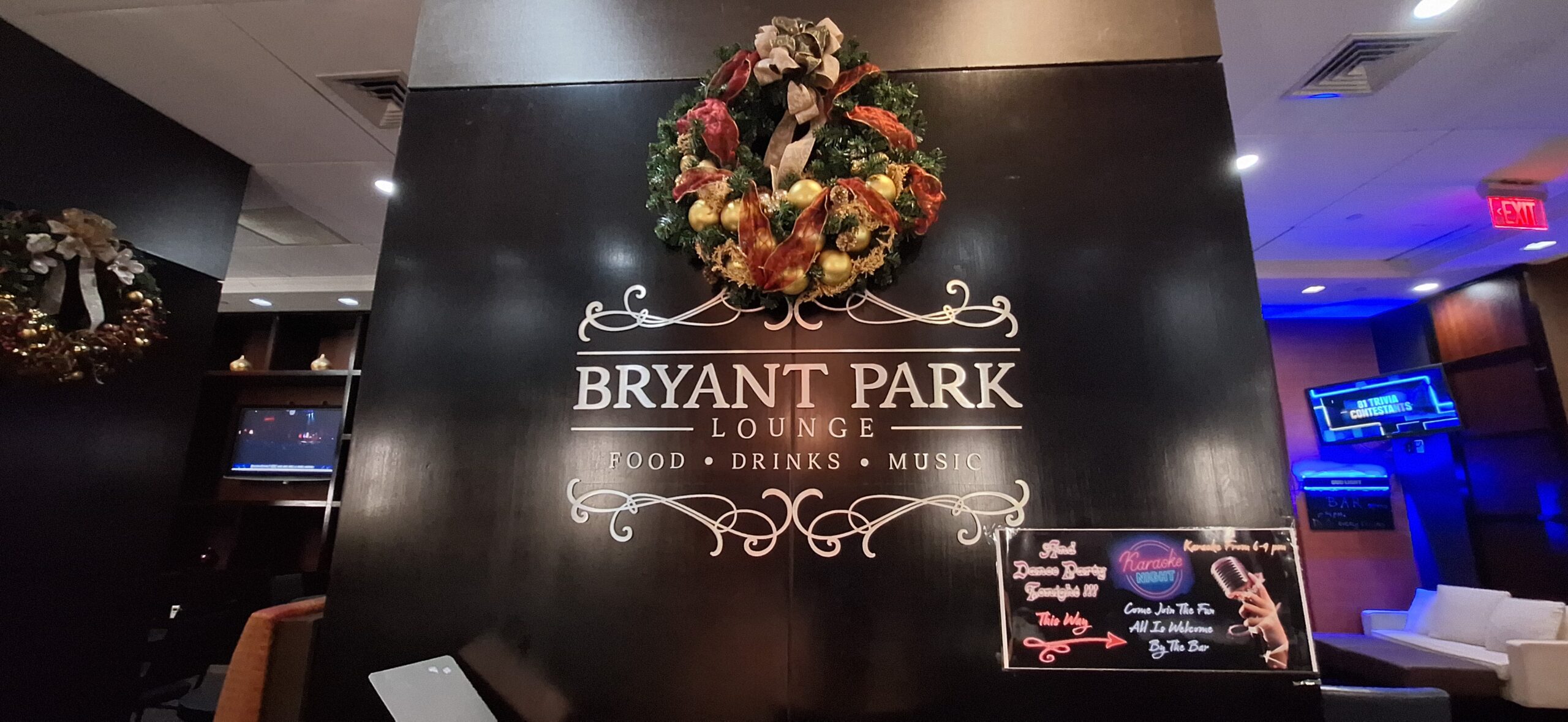 a sign with a wreath on it