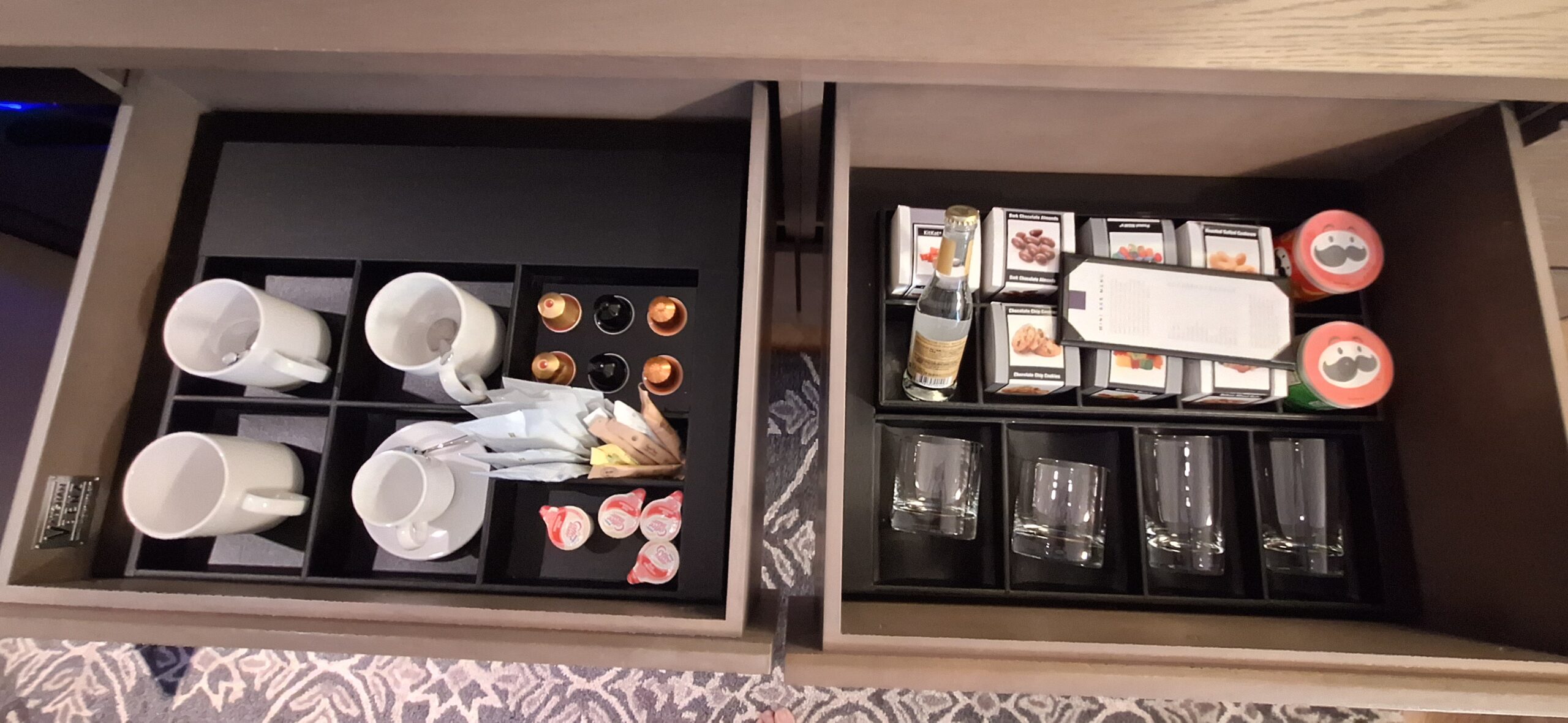 a two drawers with a tray of food and drinks