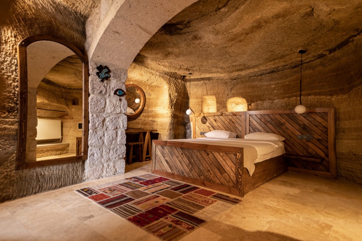 a bed in a cave room