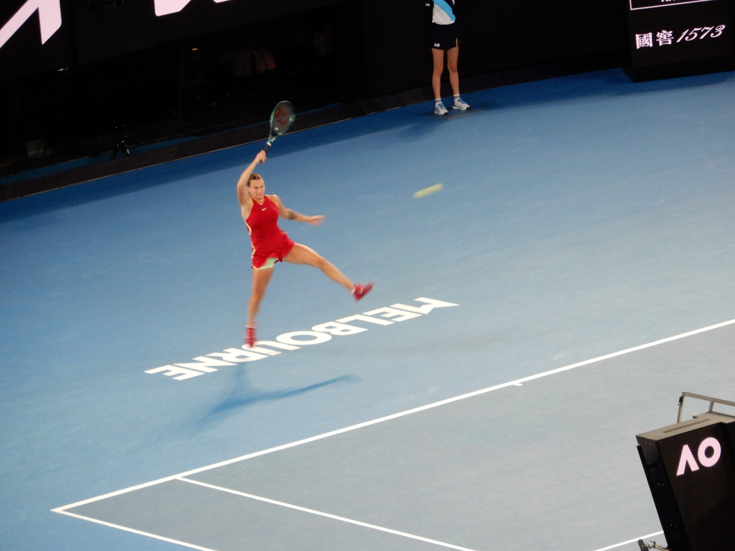 a woman playing tennis on a court