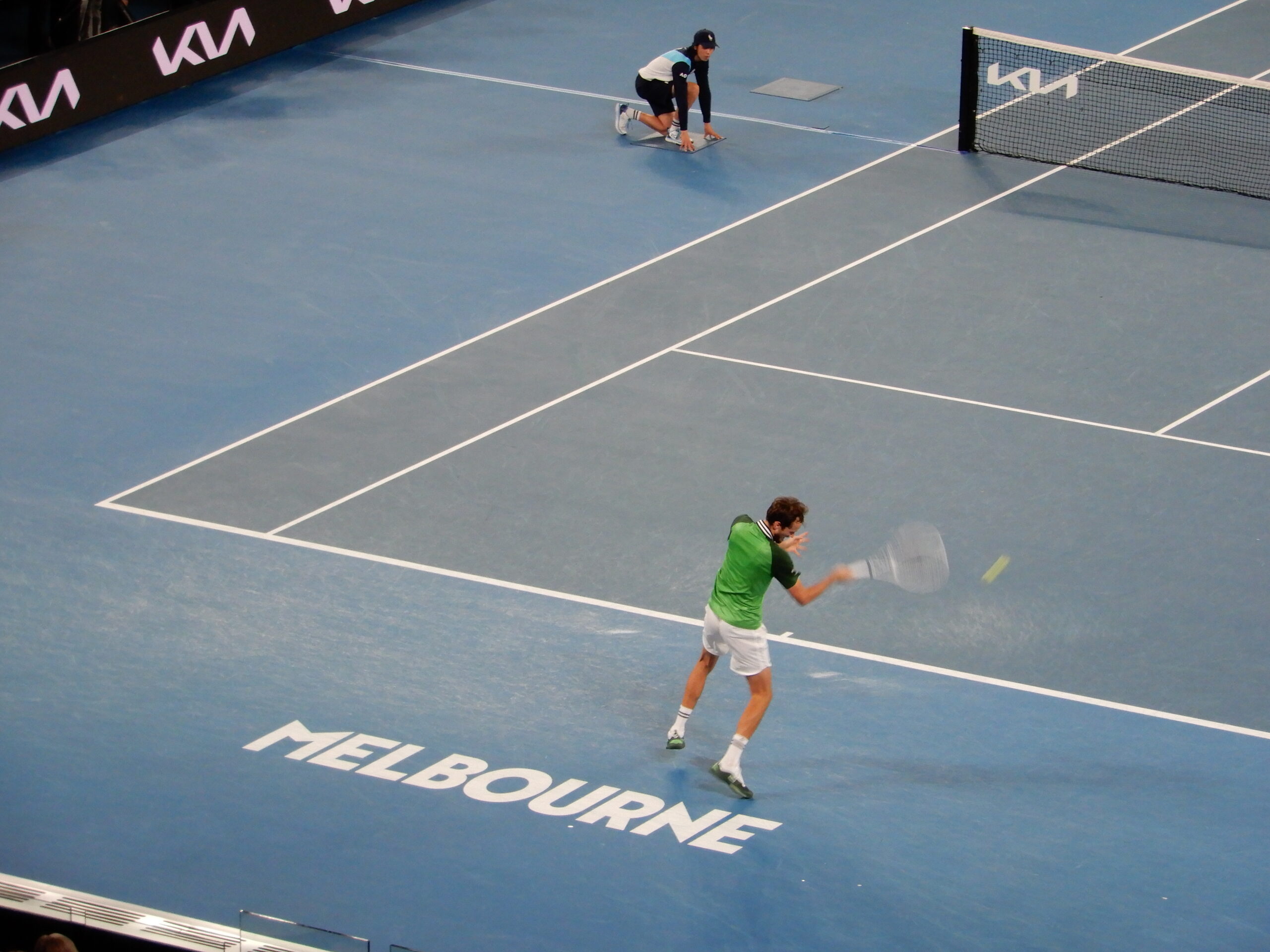 a man playing tennis on a court