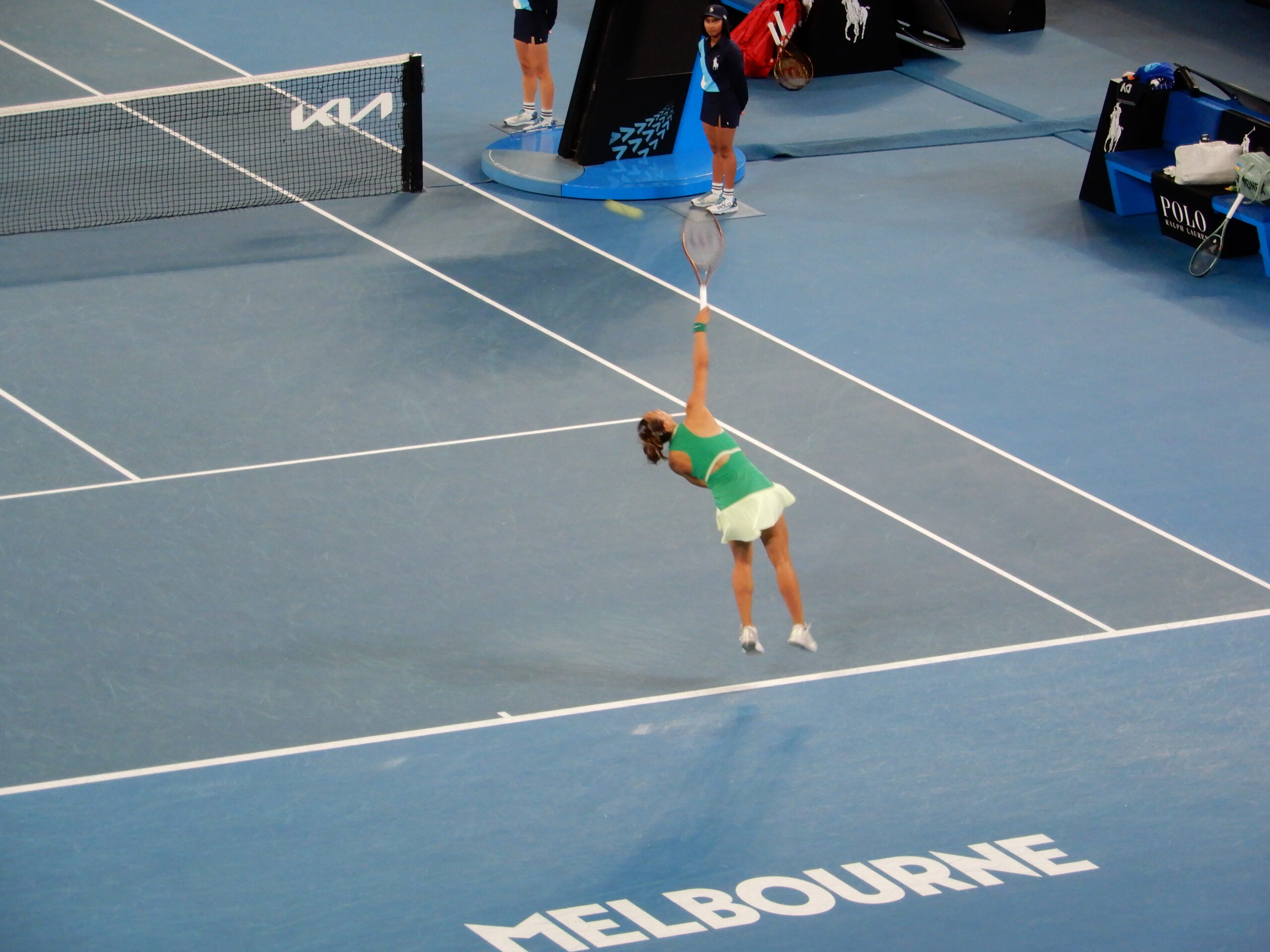 a woman playing tennis on a court