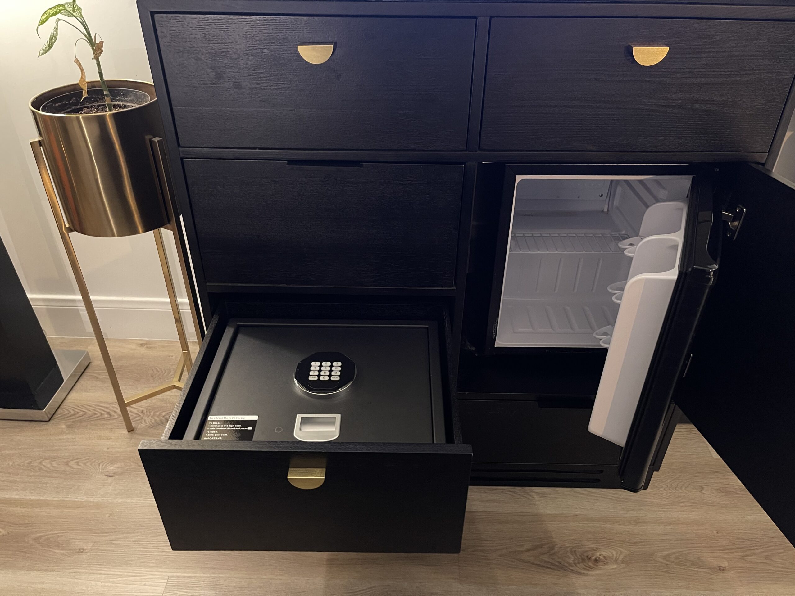 a black cabinet with a door open