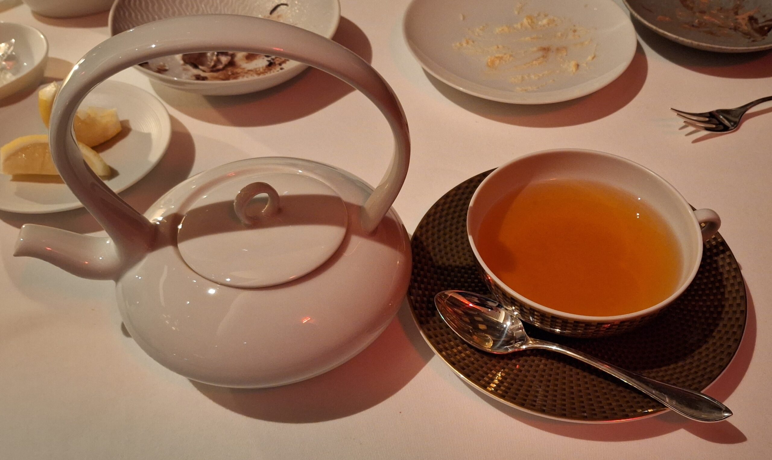 a tea pot and a cup of tea
