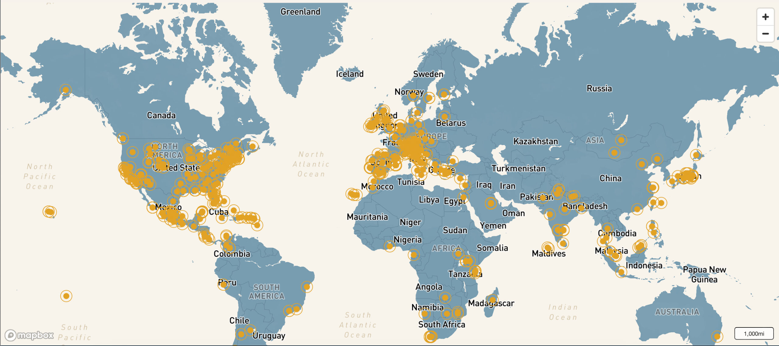 a map of the world with orange dots