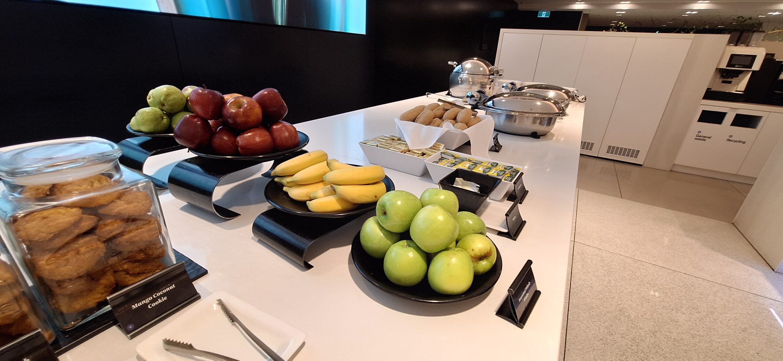 a table with bowls of fruit and vegetables