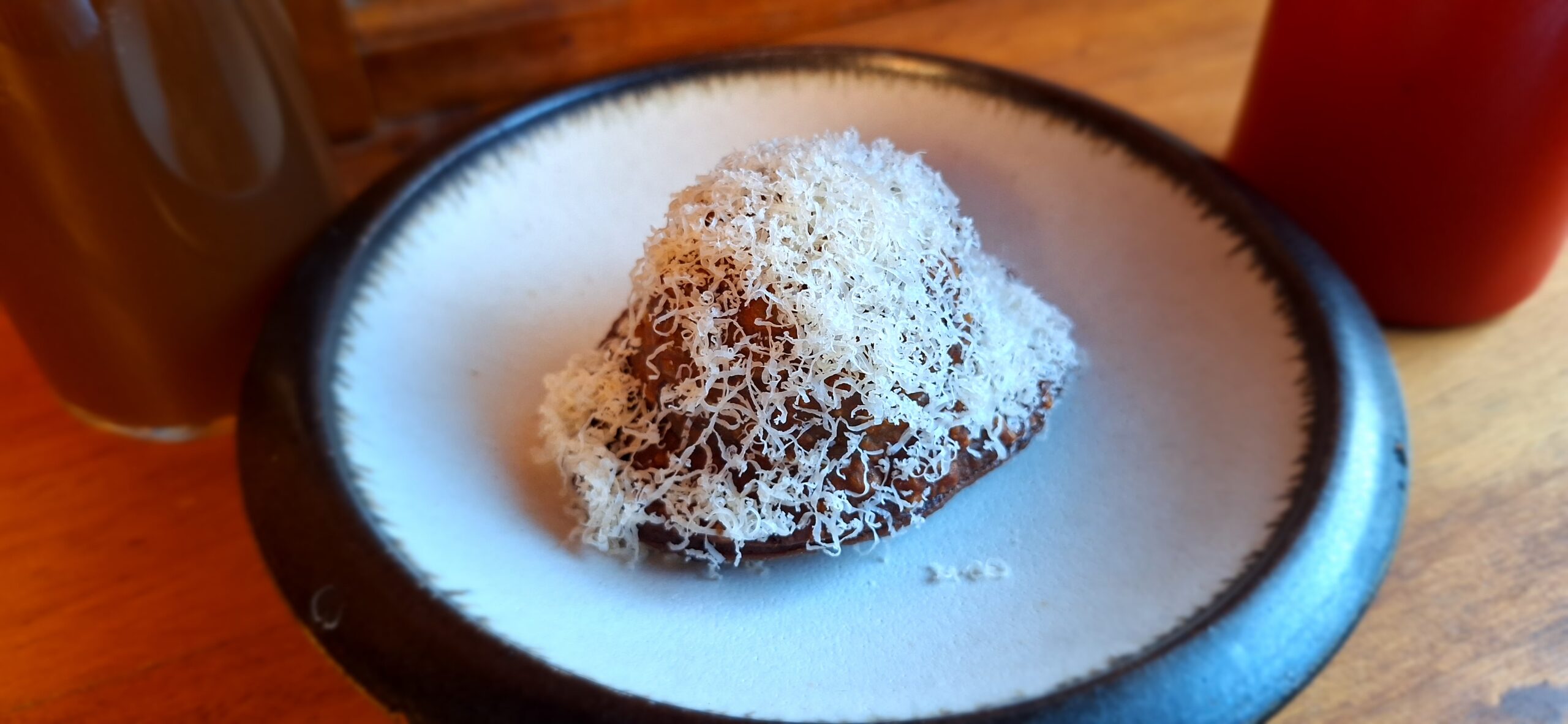 a plate of food on a wood table